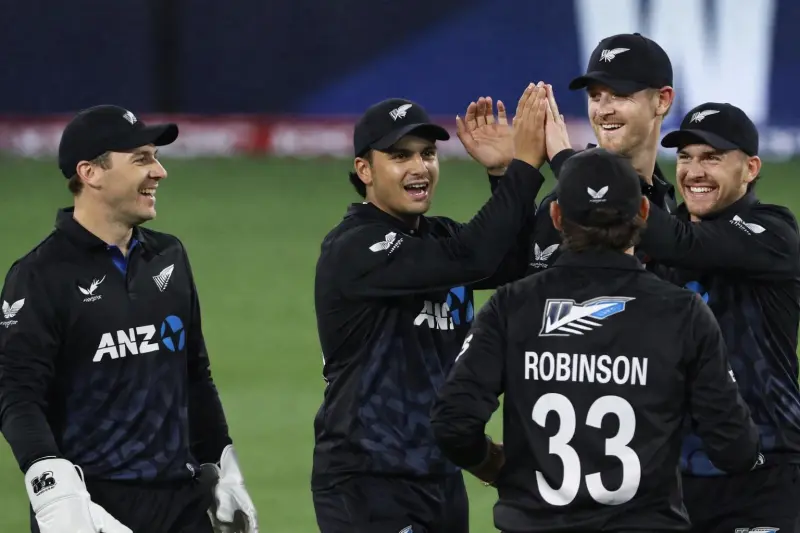 new zealand cricket players celebrating wicket t20 match team performance